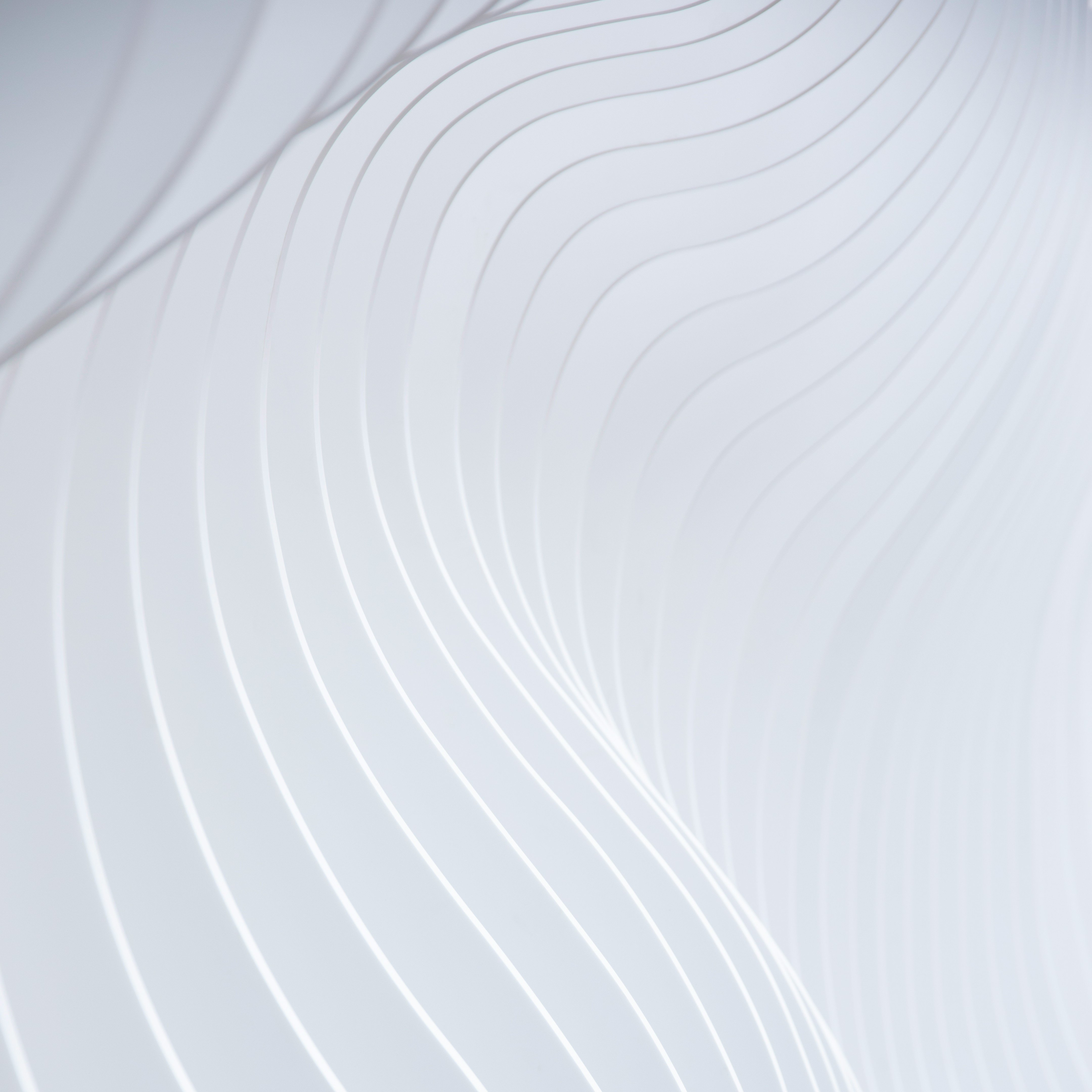 a close up of a white wall with wavy lines