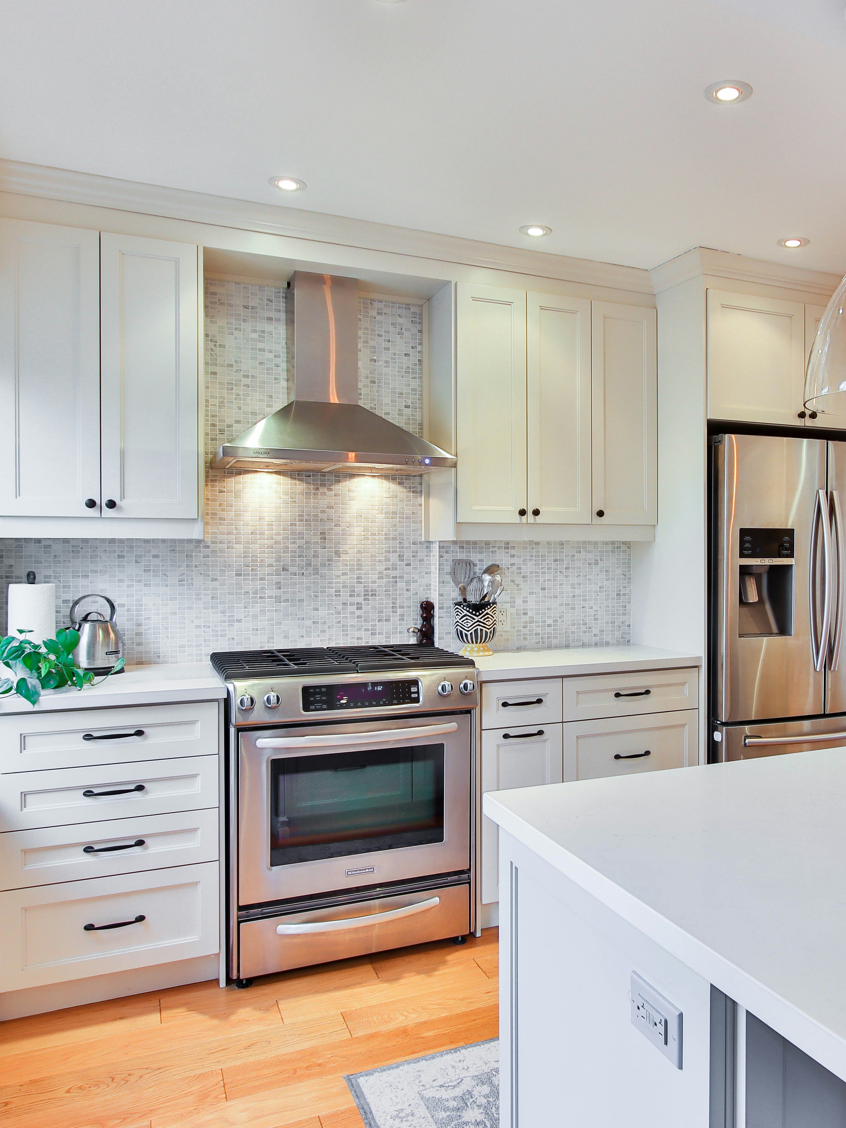 white wooden kitchen cabinet and white kitchen counter