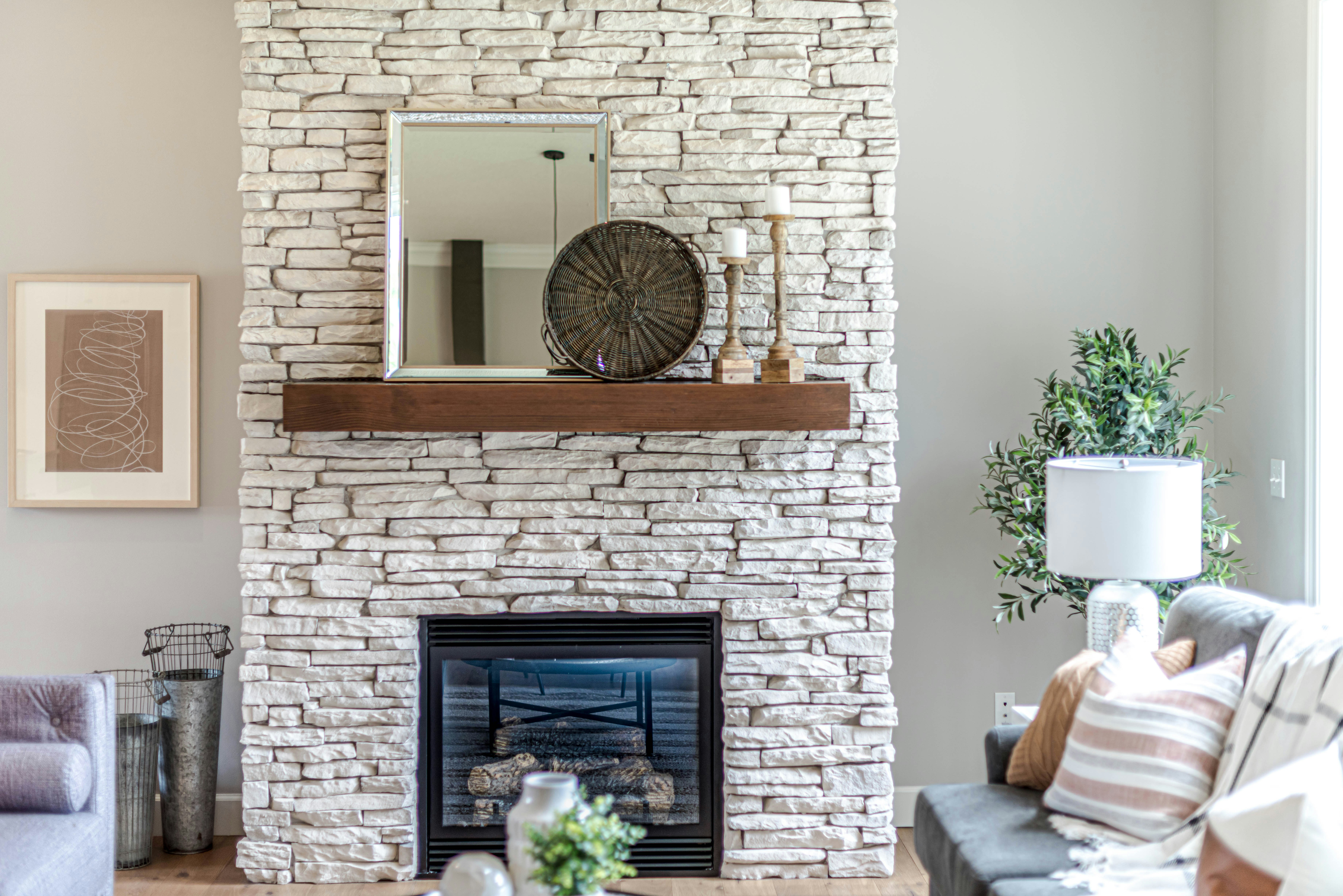 black fireplace in brown brick wall