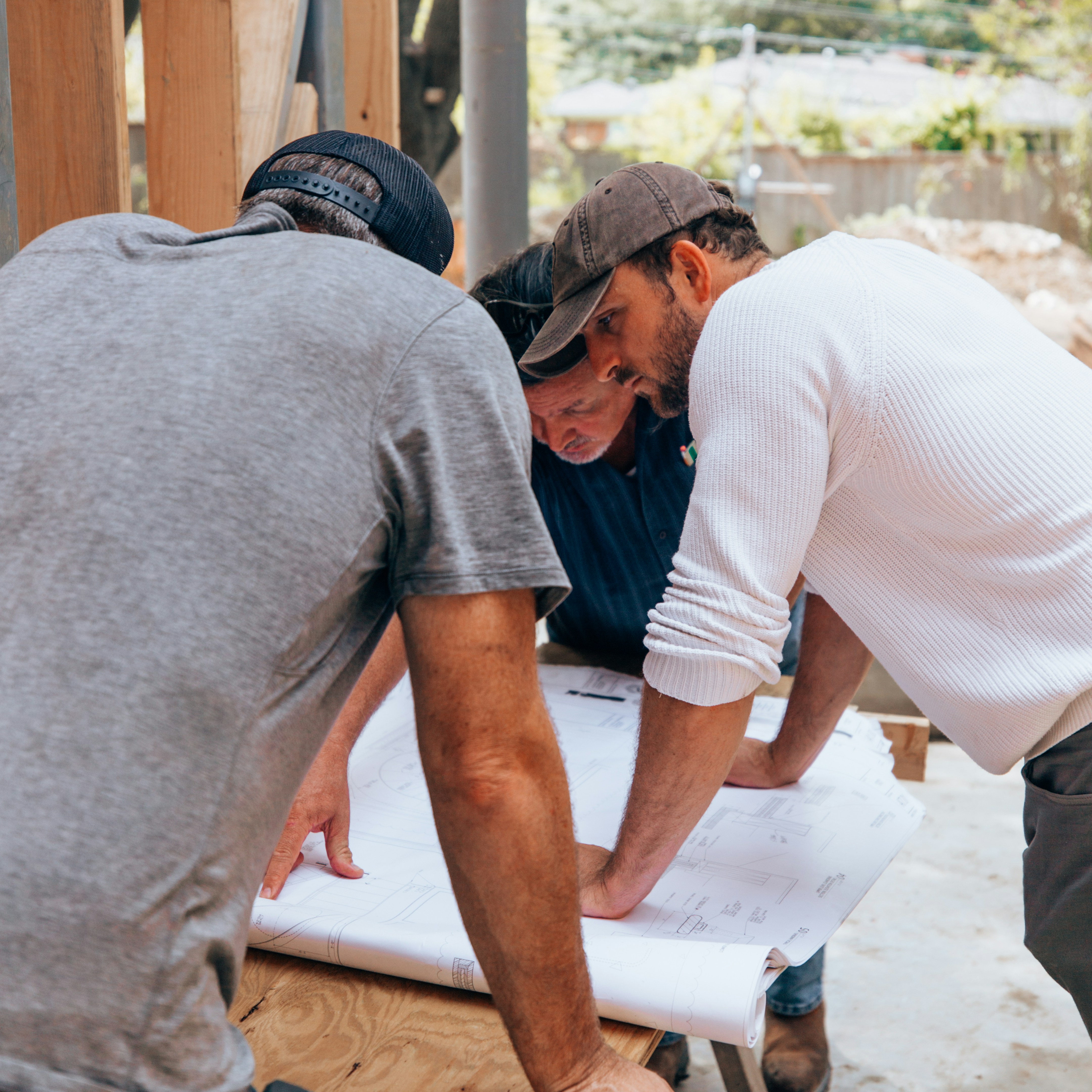 a group of men working on a project