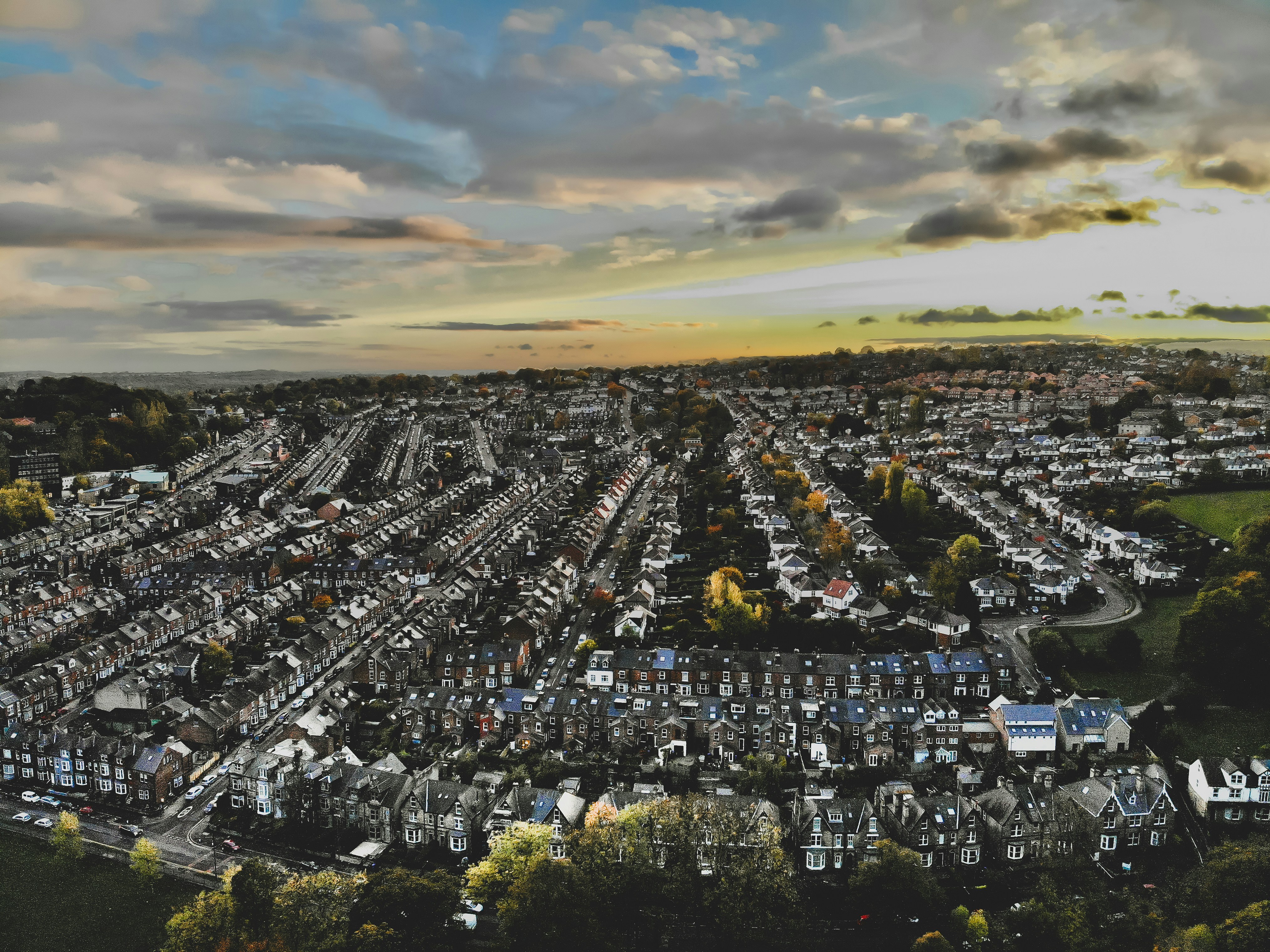an aerial view of a city with lots of houses
