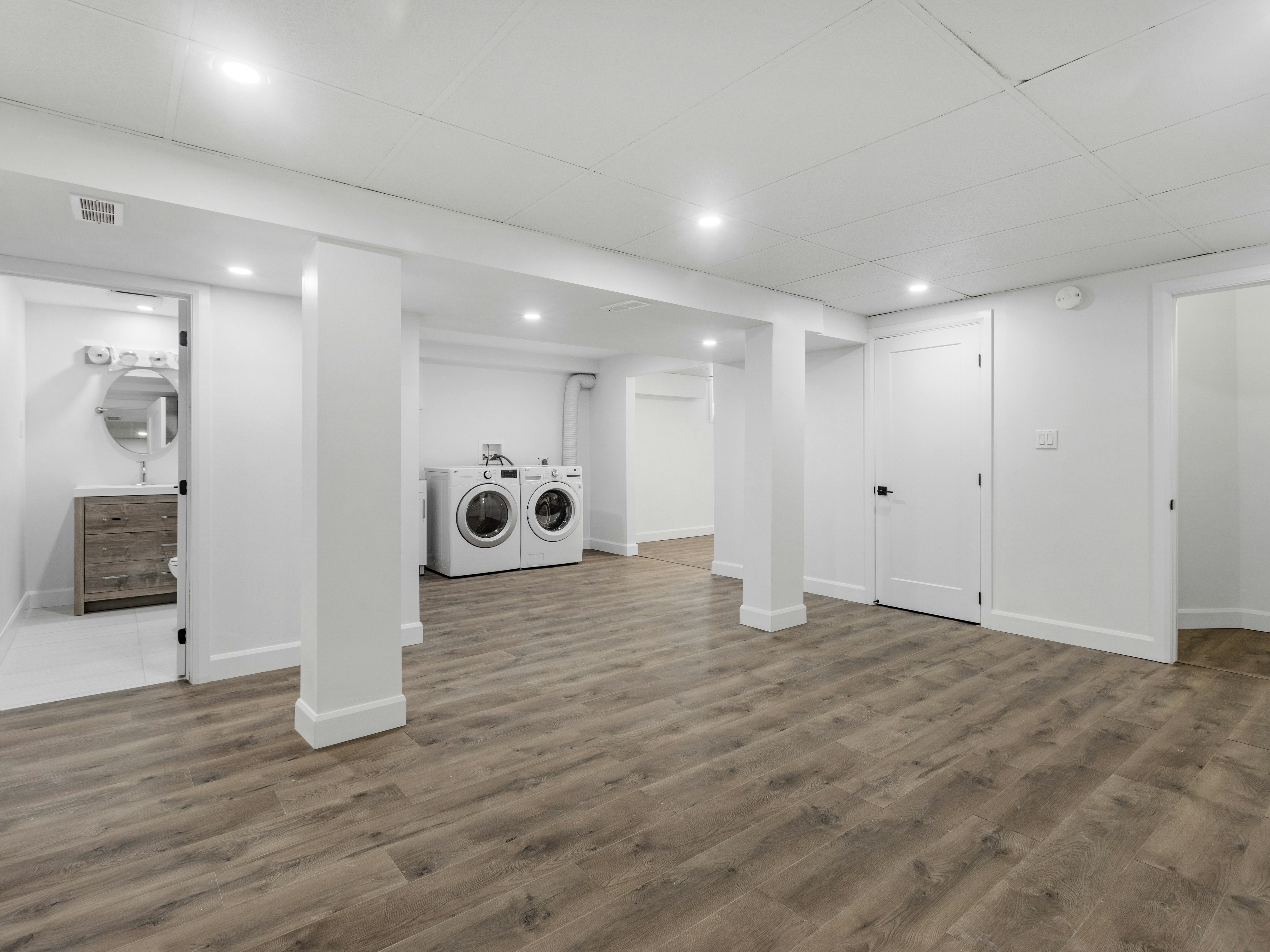 an empty room with a washer and dryer