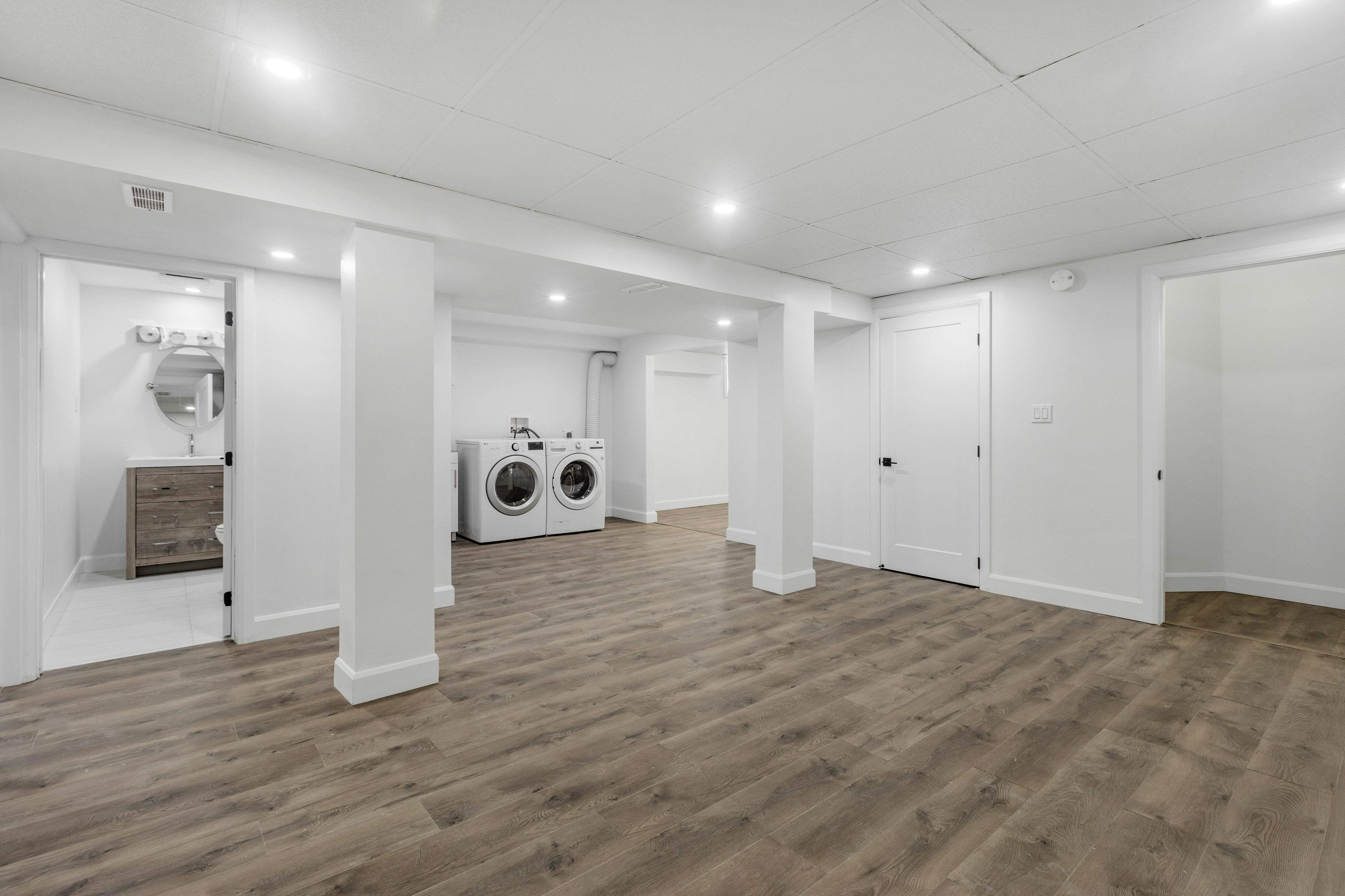 an empty room with a washer and dryer