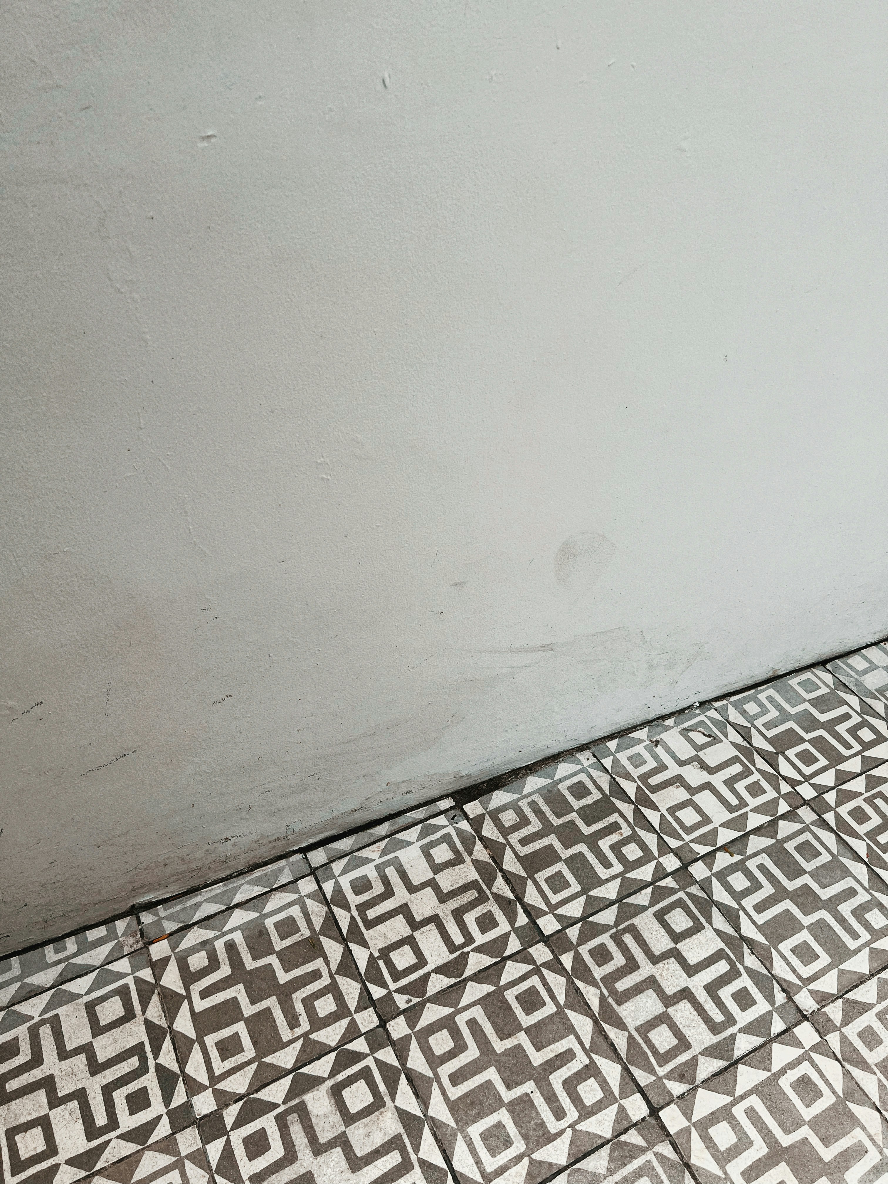 a grey and white photo of a roof