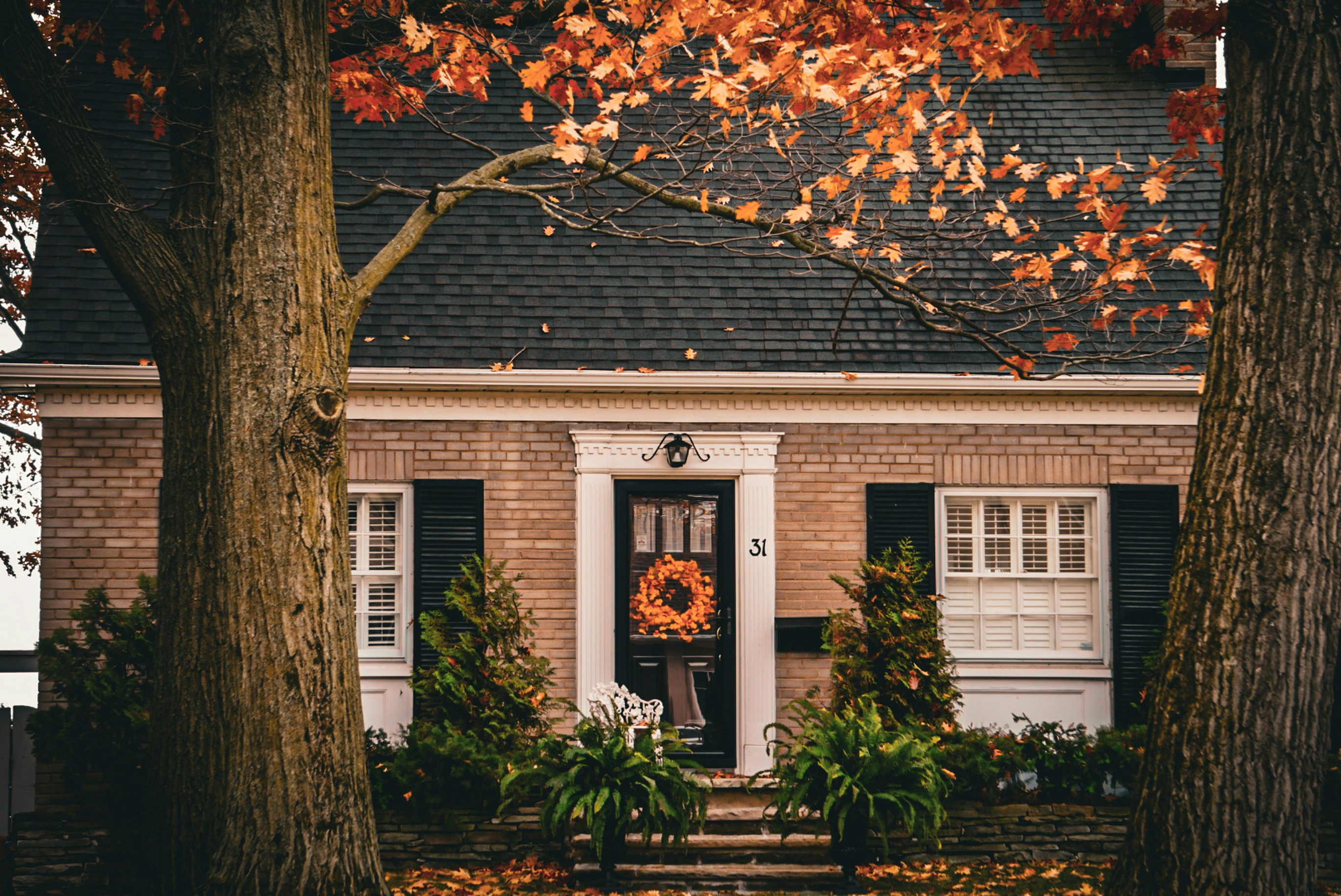 a house with a wreath on the front door