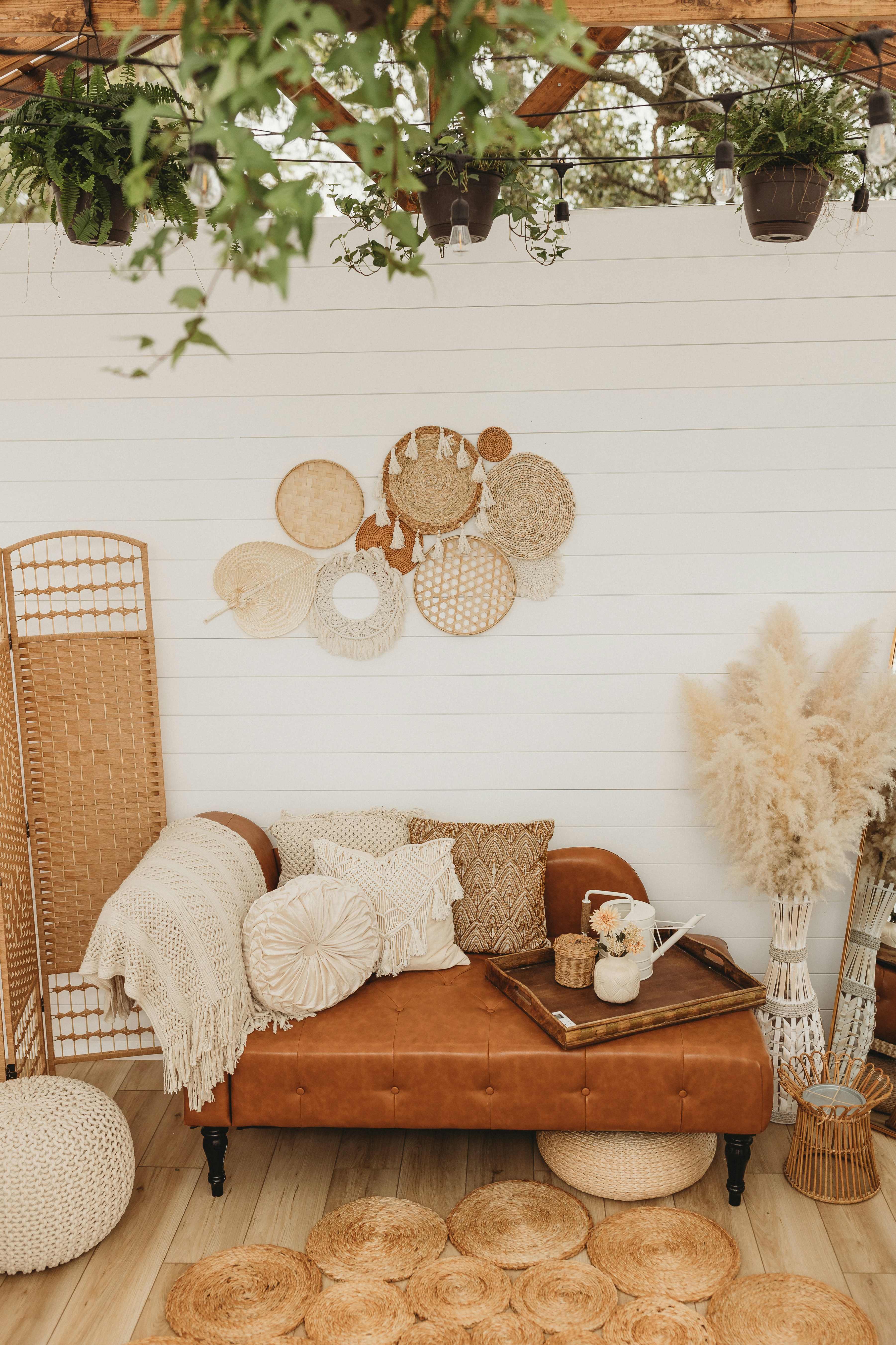 a living room filled with lots of furniture and decor
