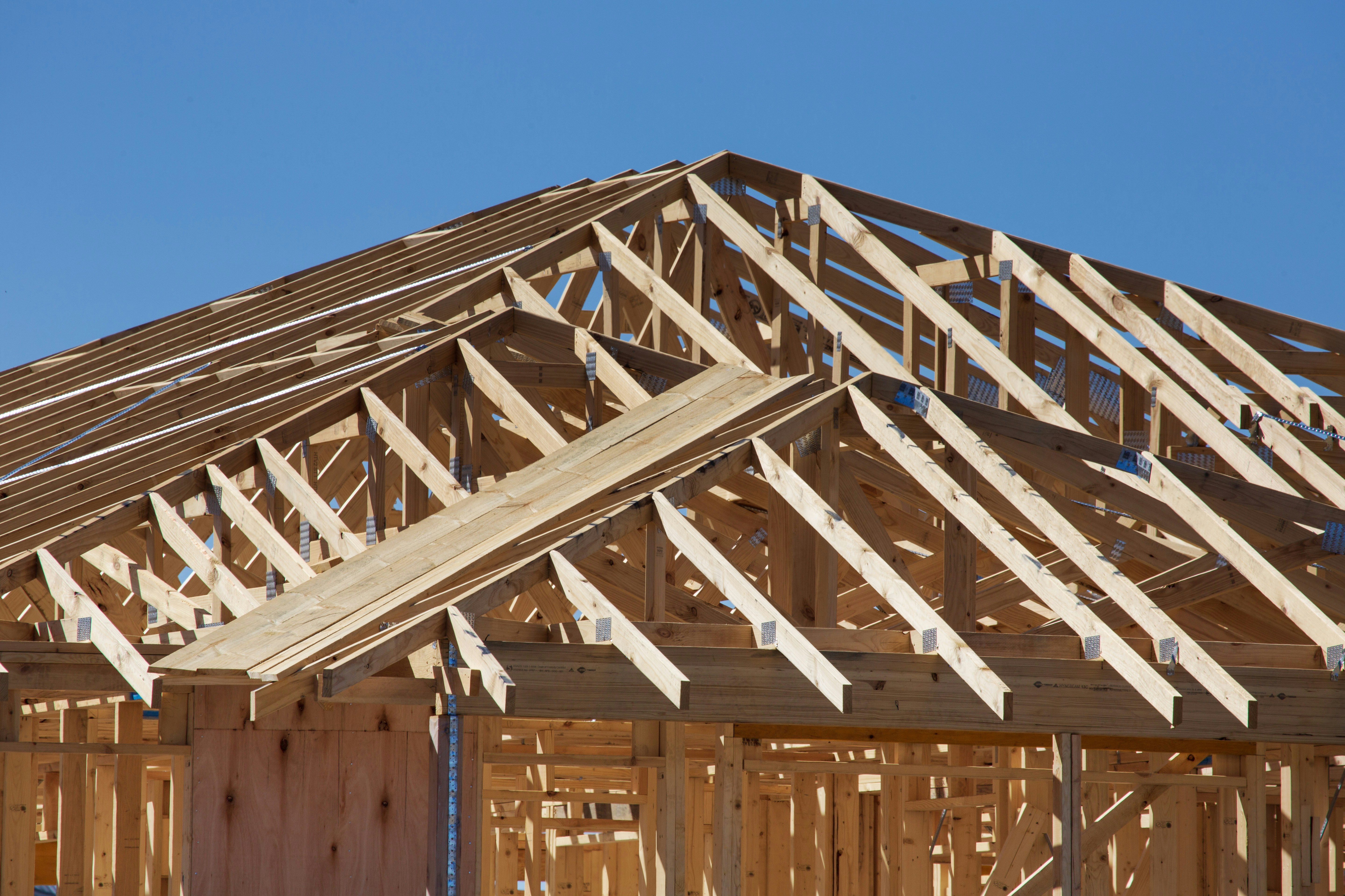 a house under construction with wooden framing