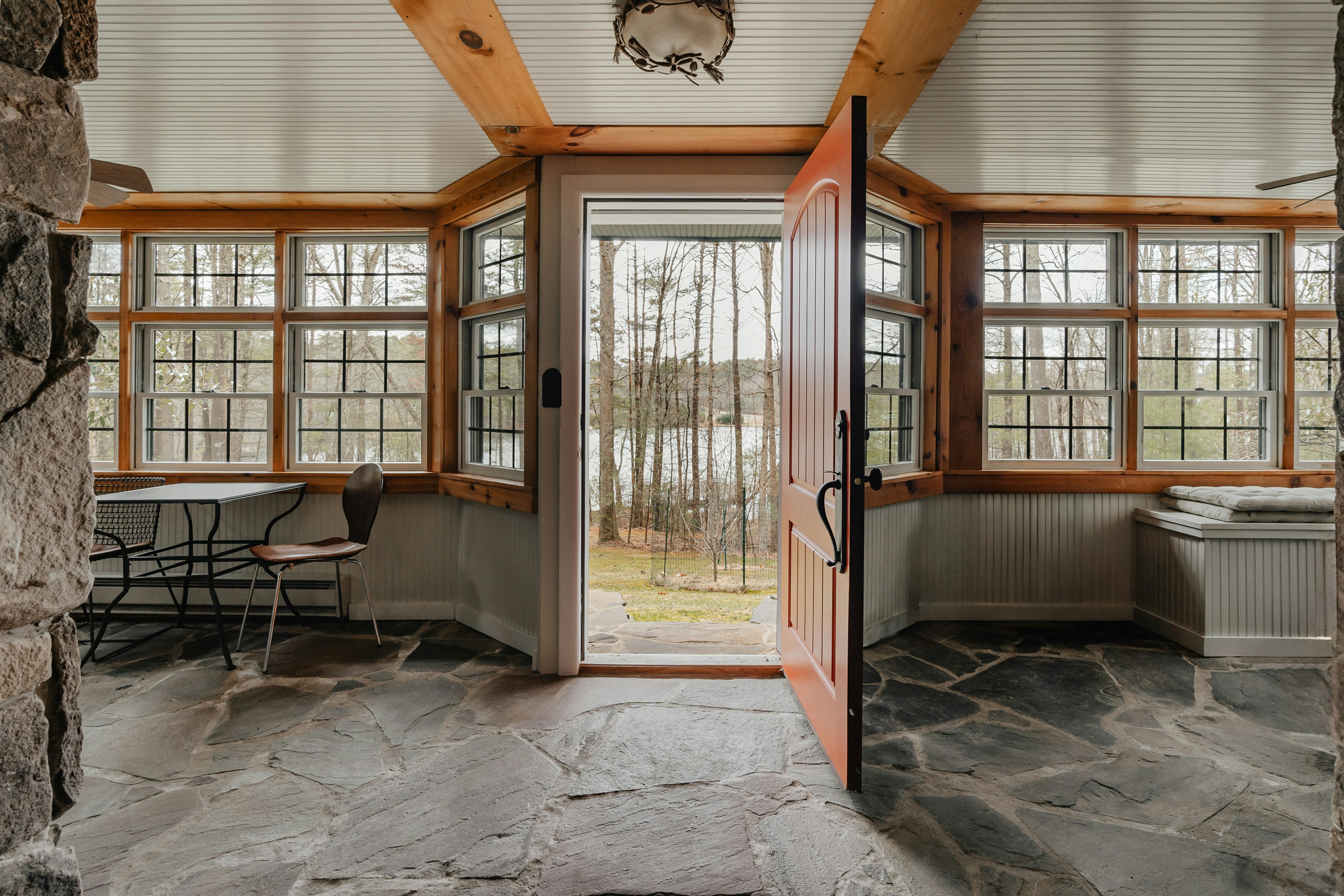 a room with a stone floor and stone walls