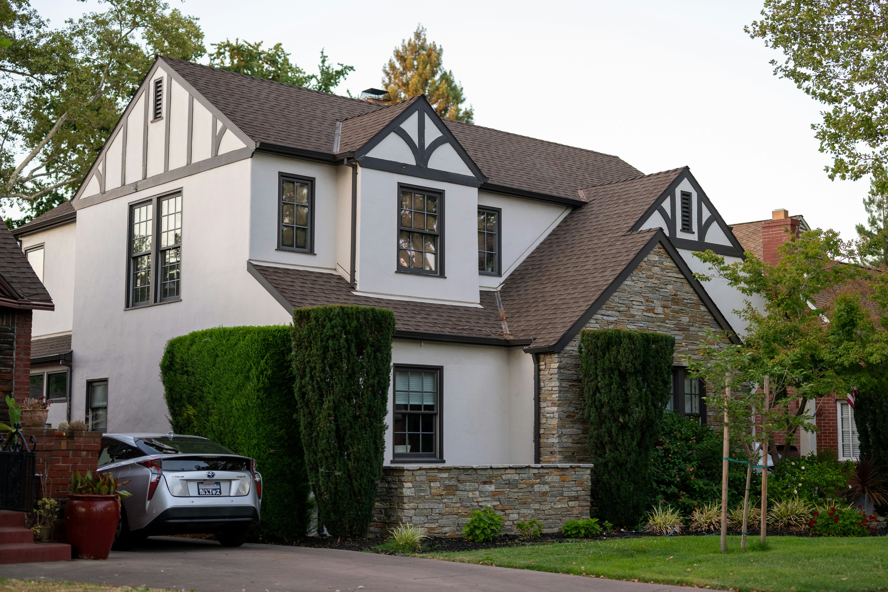 A house with a car parked in front of it