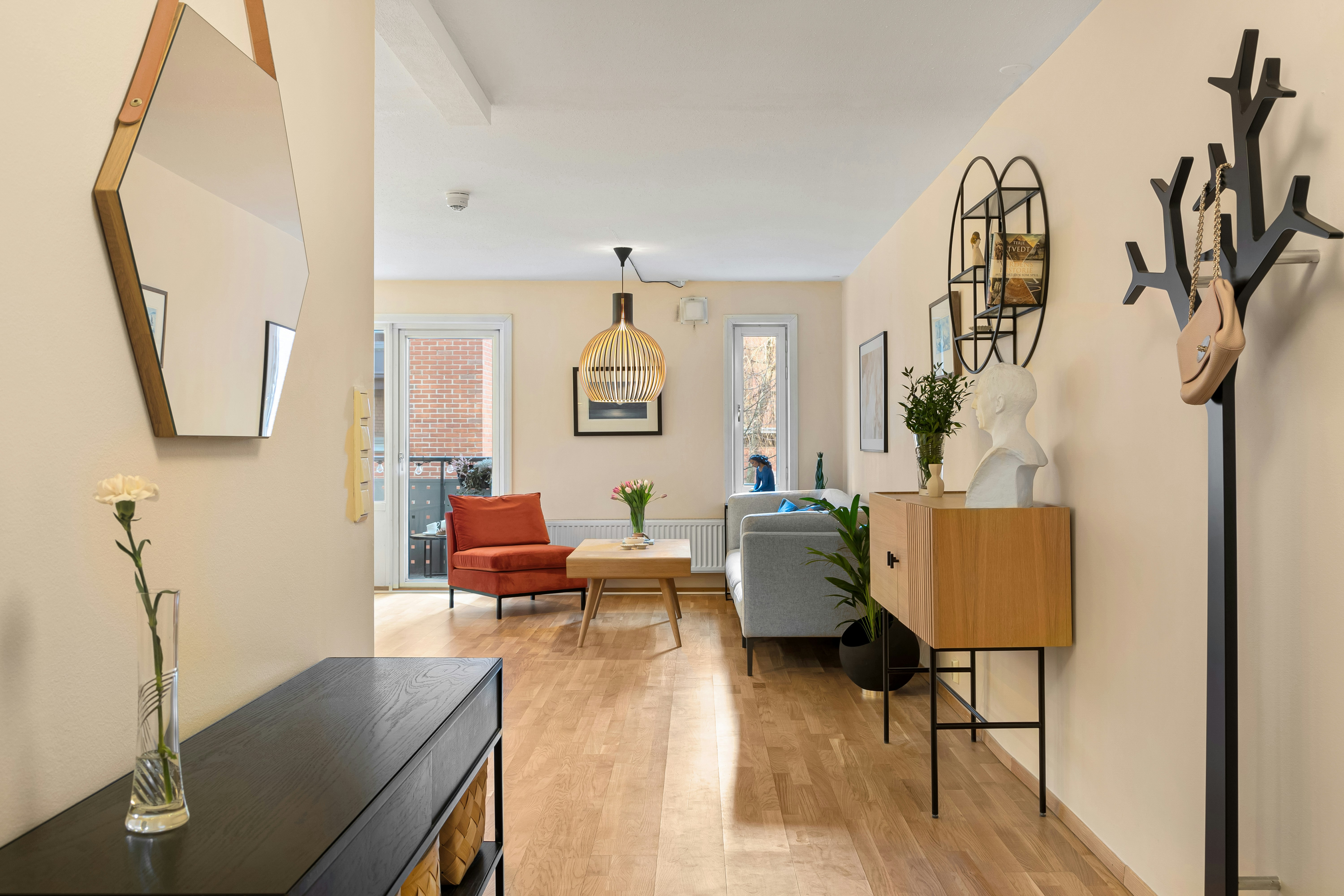 A long hallway with a clock on the wall
