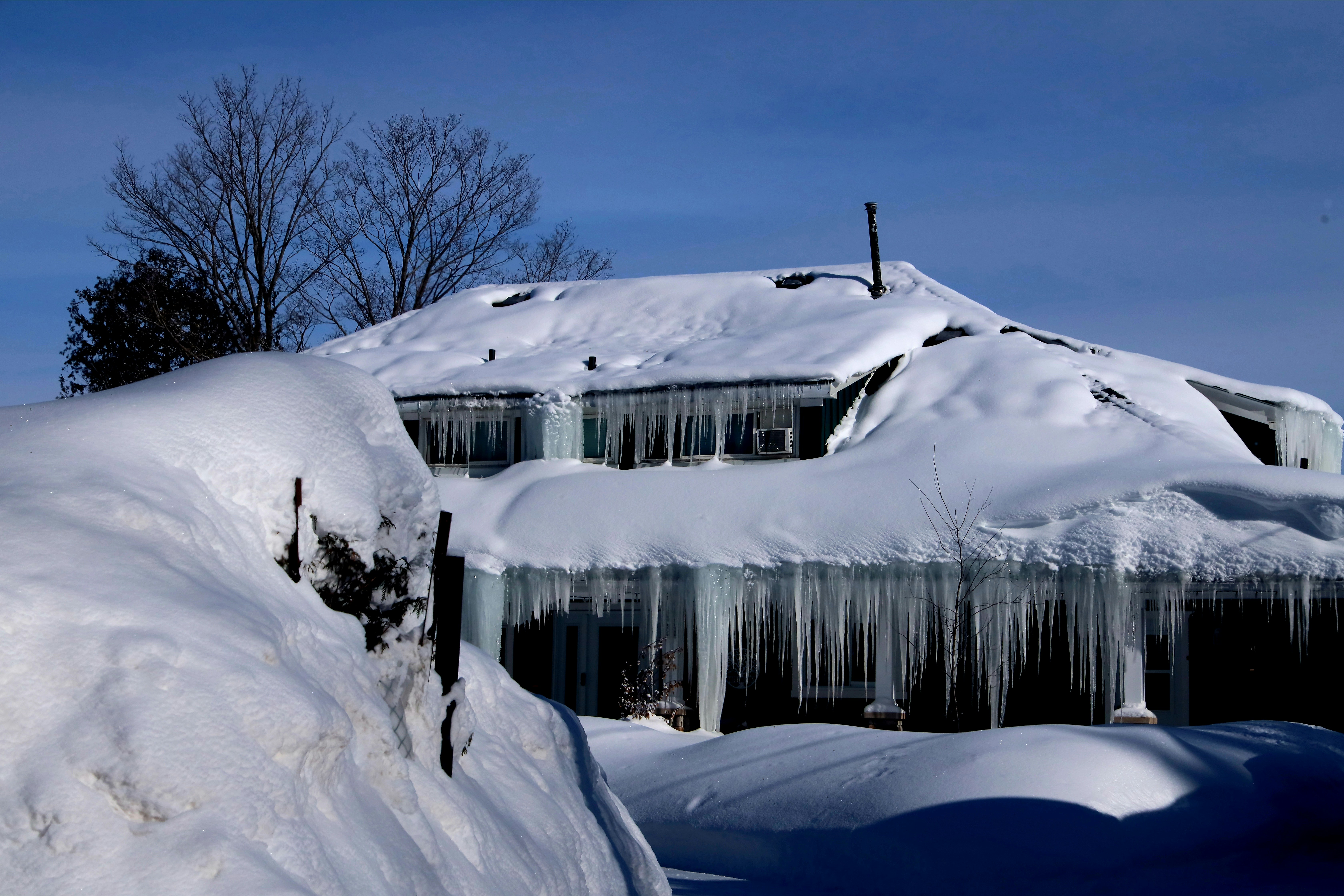 A house is covered in ice and snow