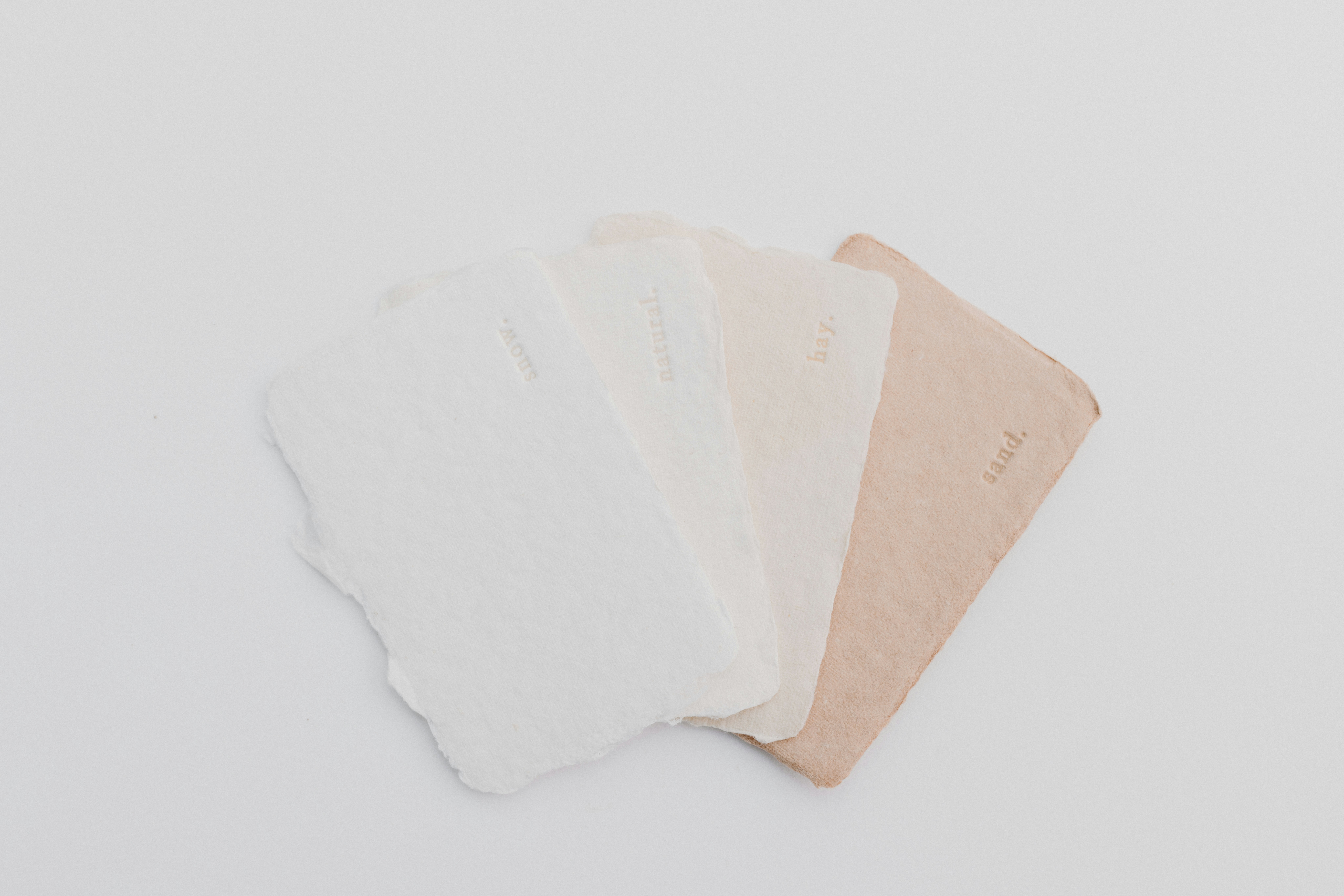 Three shades of white and beige on a white background