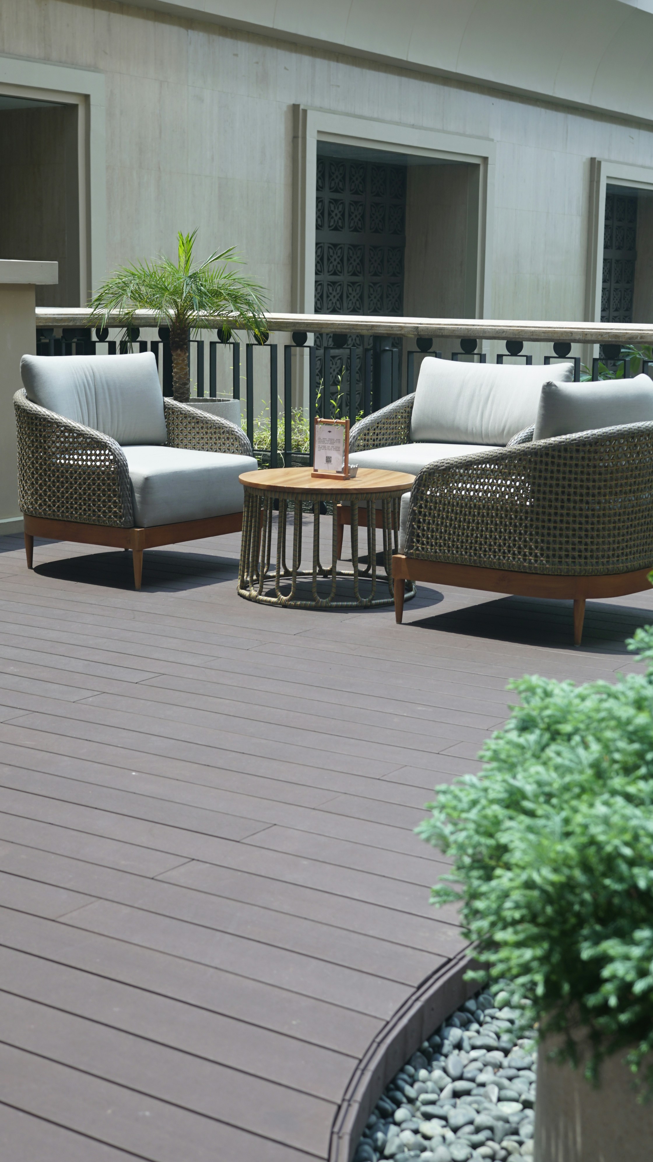 Outdoor patio furniture with chairs and a coffee table.
