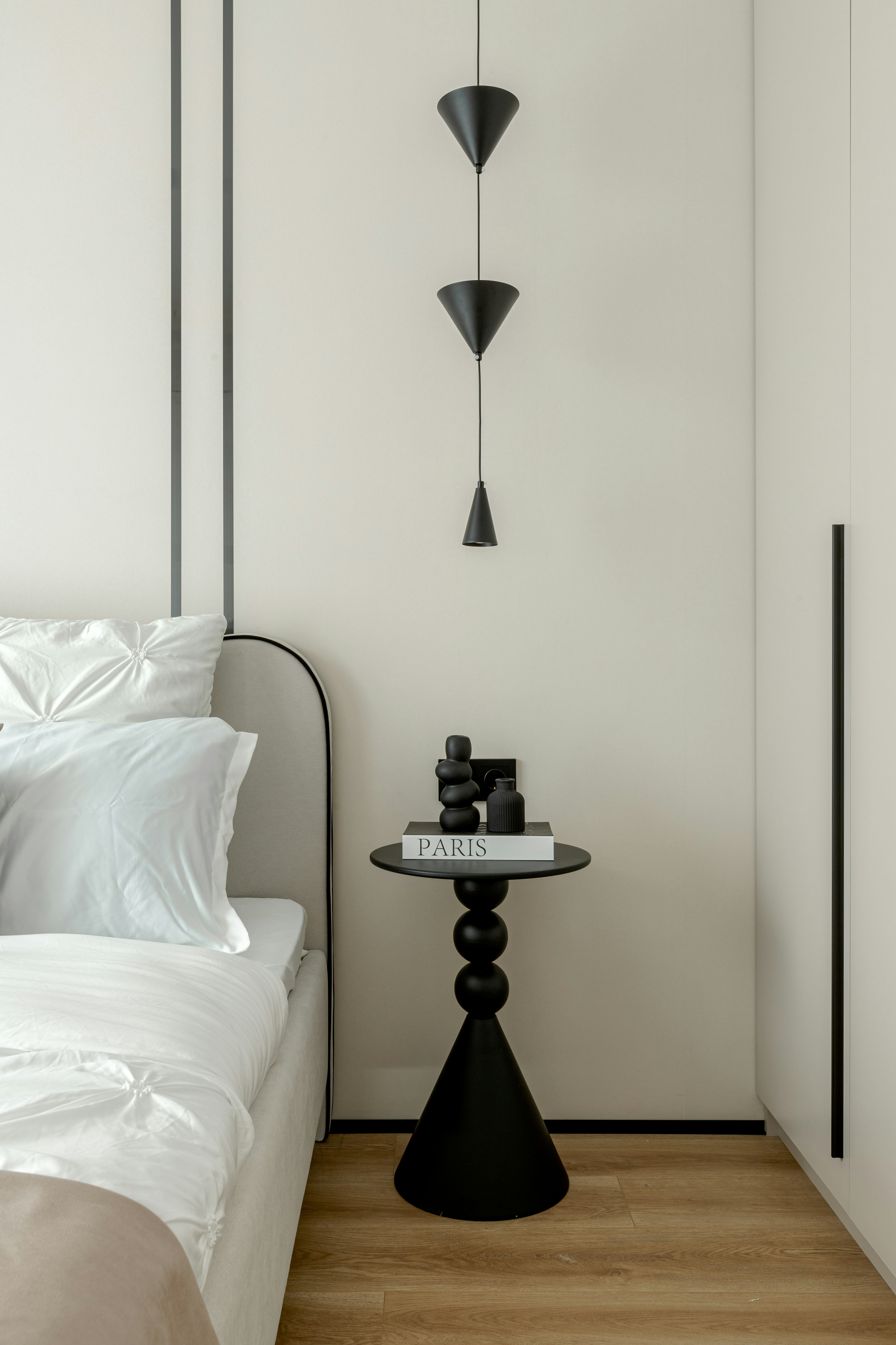 Modern bedroom with black accents and minimalist decor