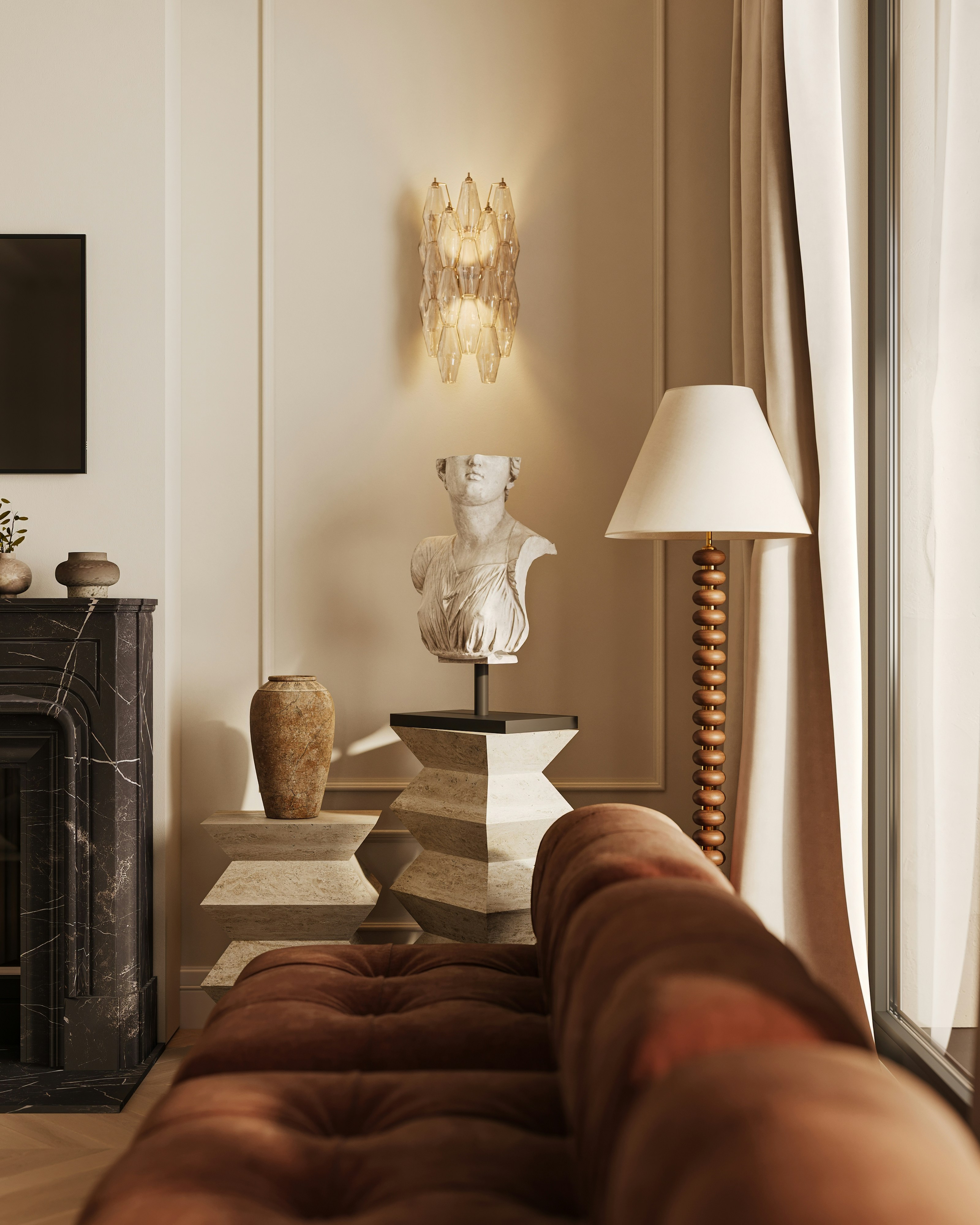 Elegant living room with a classic bust and tufted sofa.